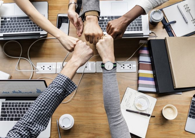 Colleagues giving a fist bump